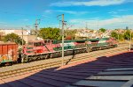 FXE AC4400 Locomotives leading a mixed freight train